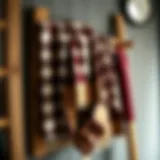 Buffalo plaid towel draped elegantly over a rustic wooden rack