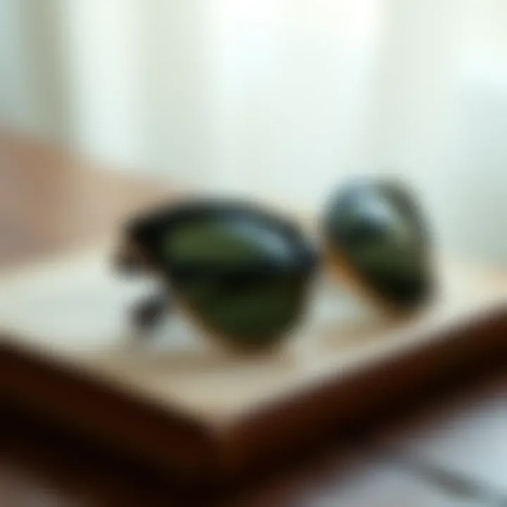 Close-up of iconic cat-eye sunglasses resting on a vintage book, highlighting the elegance of classic design