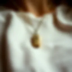 Elegant emergency whistle necklace displayed on a soft fabric background.