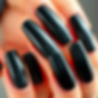 Close-up view of black long press on nails showcasing their shine and texture