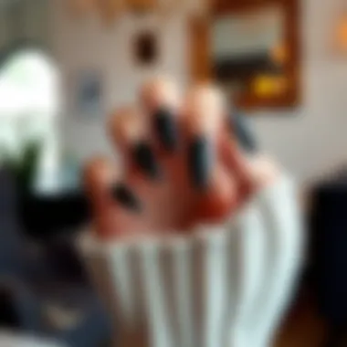 Elegant black long press on nails against a chic backdrop