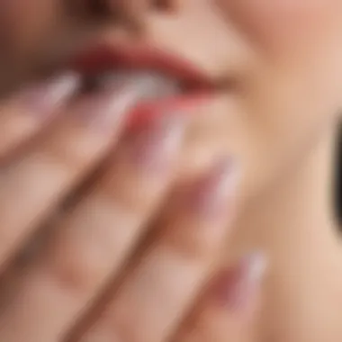 Close-up of well-maintained crystal acrylic nails