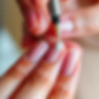 Close-up of nail shimmer powder being applied onto nails