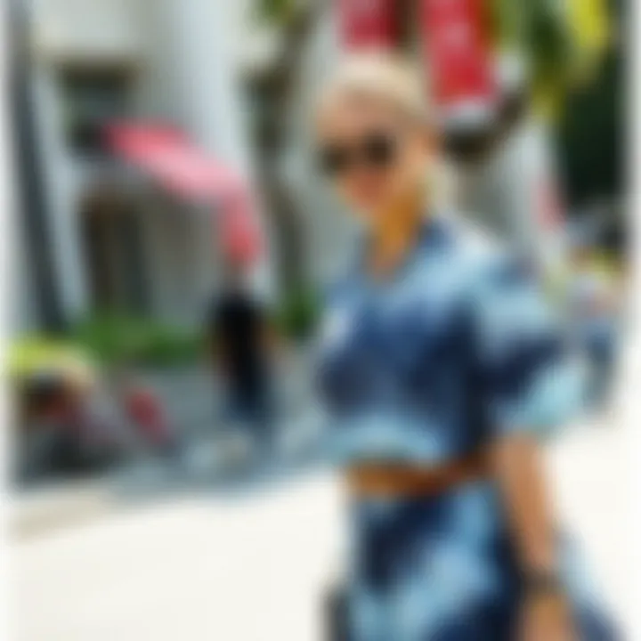 A stylish individual wearing a tie-dye shirt dress accessorized for a casual outing