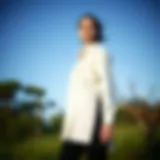 Elegant long shirt with side slits showcased in a natural setting