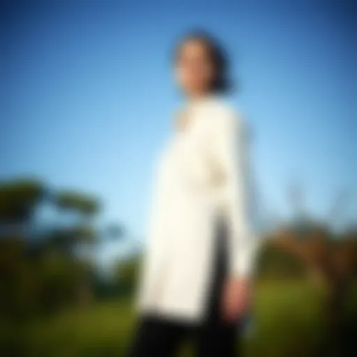 Elegant long shirt with side slits showcased in a natural setting