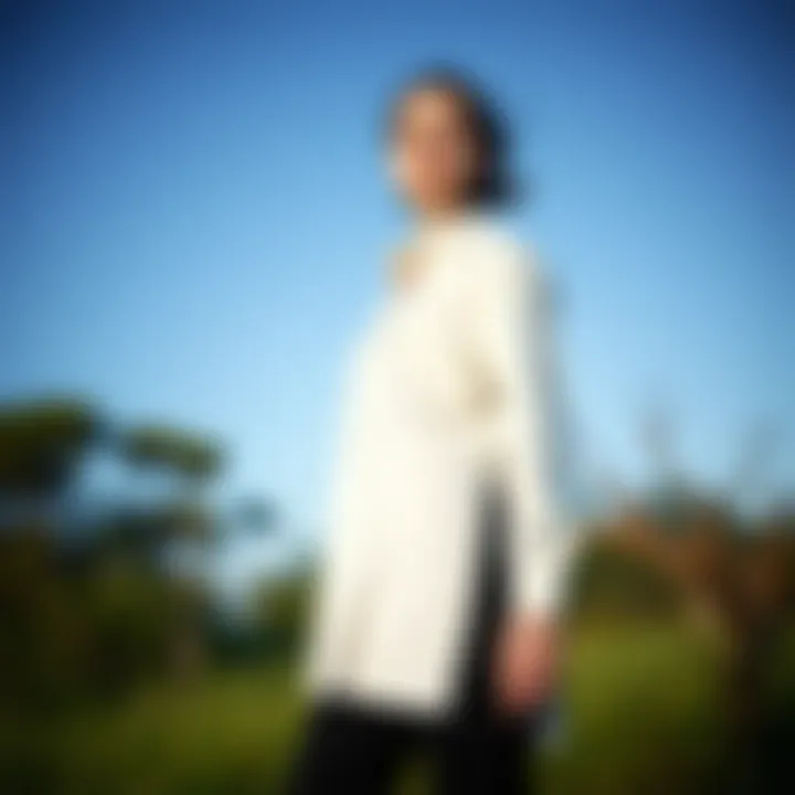 Elegant long shirt with side slits showcased in a natural setting