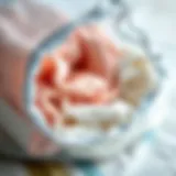 Protecting Delicates with Mesh Bags Close-up of a small mesh laundry bag filled with delicate fabrics