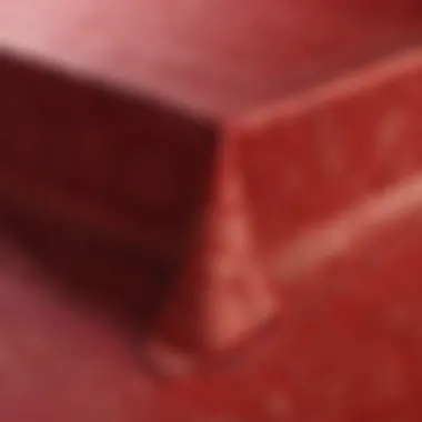 Close-up of intricate designs on a red tablecloth