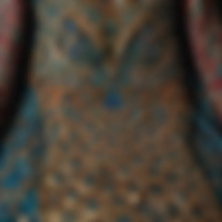 Close-up of intricate patterns and textures on a peacock caftan