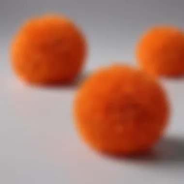 Artistic display of orange pom poms showcasing modern design trends