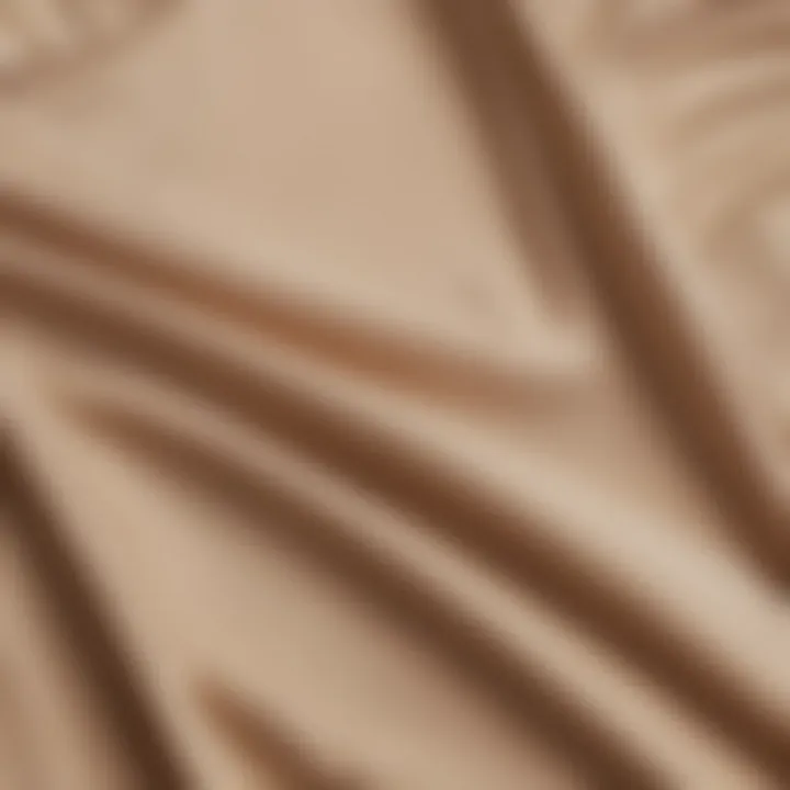 Close-up of luxurious fabric of a beige tank dress.