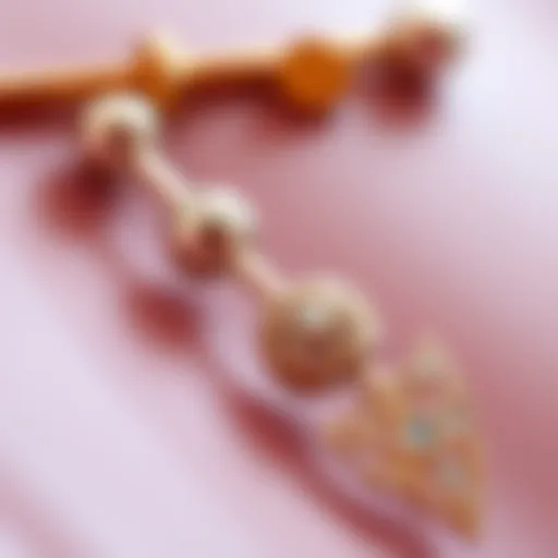 A close-up view of elegant belly ring short bars showcasing intricate designs.